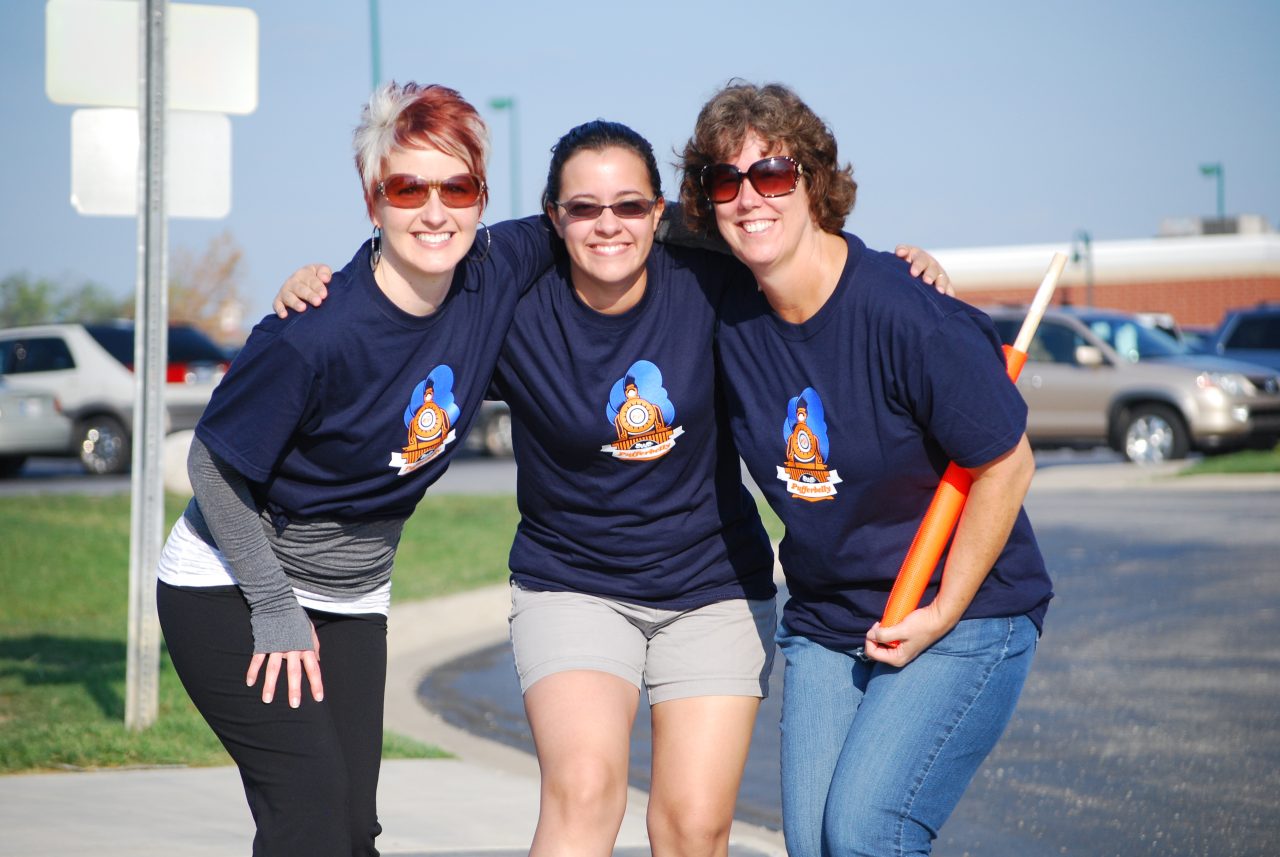 Smiling volunteers at one of the pufferbelly run walk and stroll
